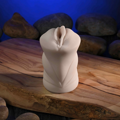 Upright angle of vagina stroker highlighting sculpted twist-form body shape