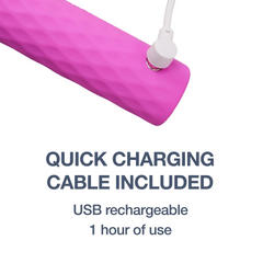 USB charging cable connected to base of pink super bullet, showing magnetic charging port detail