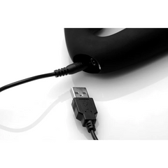 USB charging cable connected to Tri-Volver strapless strap-on magnetic charging port