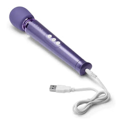Violet Le Wand Petite Massager connected to white USB charging cable, rechargeable design