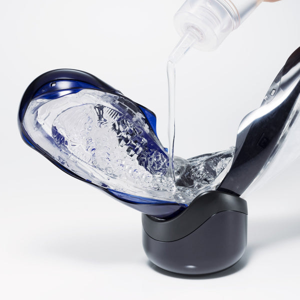 Water-based lubricant poured into open FLIP 360 on its drying stand, showing cleaning step