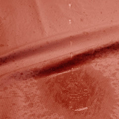 Close-up of waterproof layer with water droplets beading on the blanket's sealed underside