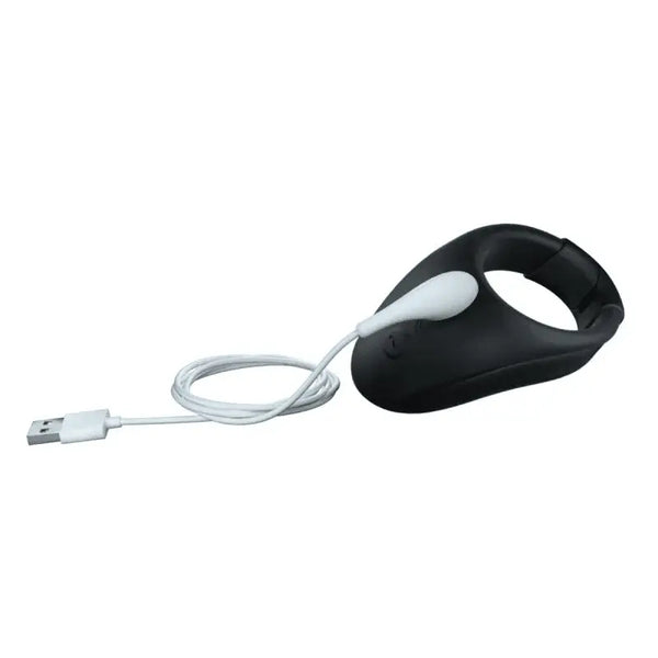 We-Vibe Bond cock ring connected to magnetic USB charging cable during charging