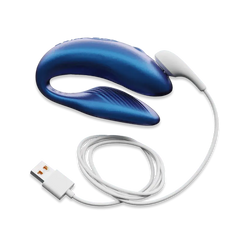 We-Vibe Chorus connected to USB magnetic charging cable on white background