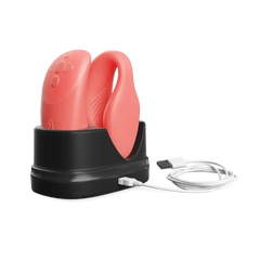 We-Vibe Chorus vibrator and remote seated in black charging dock with USB cable attached