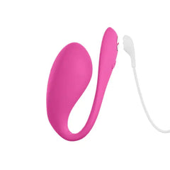 We-Vibe Jive 2 pink wearable vibrator connected to white USB magnetic charging cable