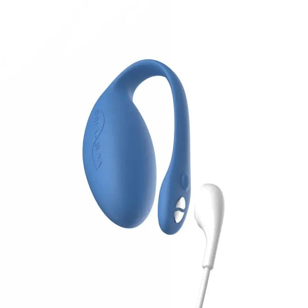 We-Vibe Jive blue egg vibrator connected to white USB magnetic charging cable, side view