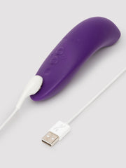 We-Vibe Melt 2 lying flat connected to white USB magnetic charging cable