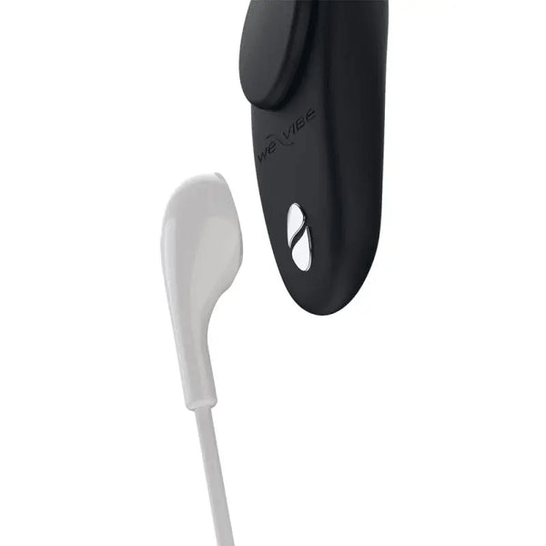 We-Vibe Moxie+ attached to underwear waistband with magnetic clip, charging cable shown
