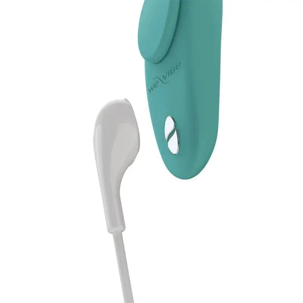We-Vibe Moxie+ panty vibe in aqua connected to white magnetic USB charging cable