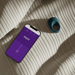 We-Vibe Pivot vibrating ring beside smartphone showing Pivot controls in the We-Connect app