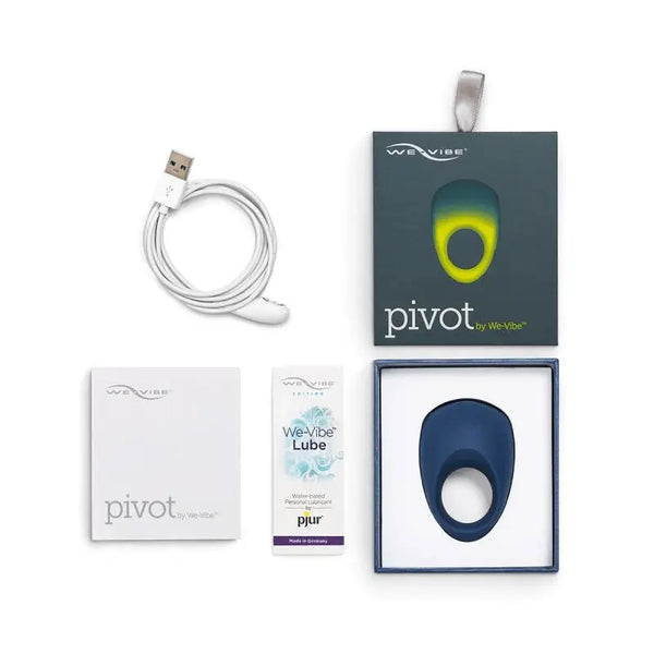 We-Vibe Pivot vibrating ring unboxed with USB cable, lube sample, and instruction booklet