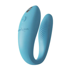 We-Vibe Sync Go in turquoise silicone showing U-shaped design with textured stimulation tip