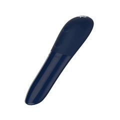 We-Vibe Tango X midnight blue bullet vibrator lying flat, highlighting textured tip detail