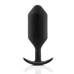 Weighted black silicone plug with faceted body and curved anchor base for secure wear