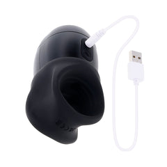 Wet It Be stroker with white USB magnetic charging cable attached to charging port