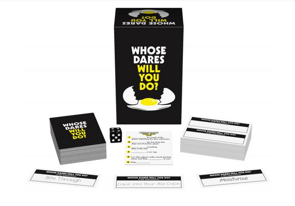 Whose Dares Will You Do? game contents spread out showing card decks, dare cards, and one die
