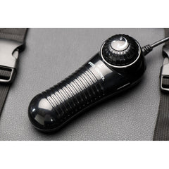 Wired handheld speed control remote with textured grip and dial for adjusting machine thrust speed