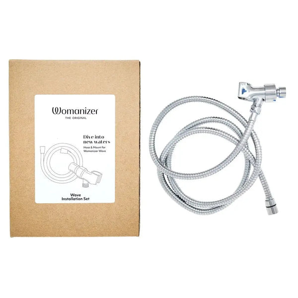 Womanizer Wave Installation Set with chrome shower hose and wall mount beside kraft box packaging