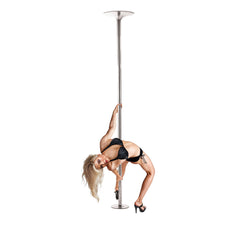 Woman performing backbend on chrome dance pole, demonstrating full-height stability