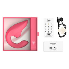 Womanizer Blend unboxed with charging cable, quick start guide, and rose-coloured device in pink box