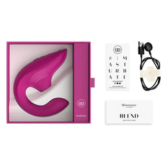 Womanizer Blend unboxed with device, USB magnetic charger, and quick start guide