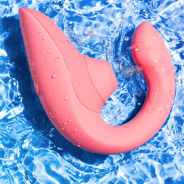Womanizer Blend vibrator covered in water droplets, demonstrating its waterproof silicone construction