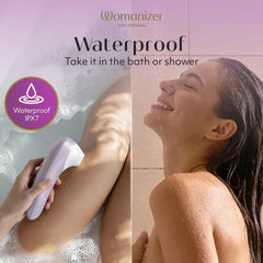Womanizer Pro near bath water and shower scene demonstrating IPX7 waterproof rating