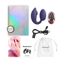 WonderLover unboxed showing vibrator, remote, USB cable, storage pouch, and holographic gift box