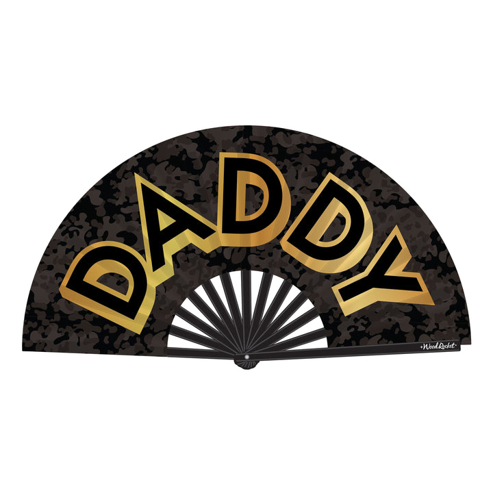 Wood Rocket Daddy Fan open flat, black camo print with bold gold metallic lettering