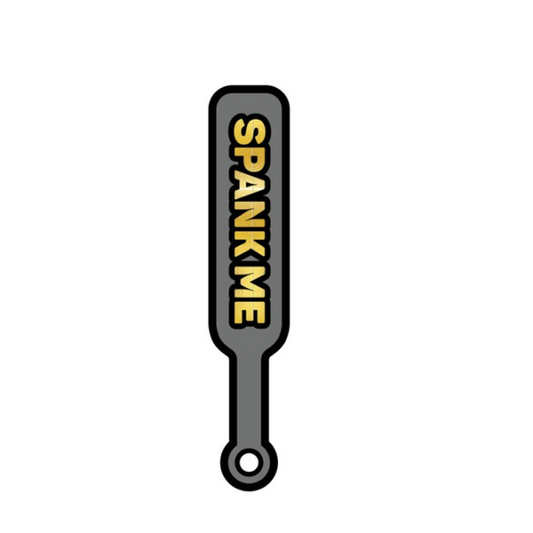 Wood Rocket grey and gold enamel paddle pin with 'Spank Me' text, front view
