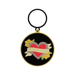 Wood Rocket tattoo heart enamel keychain with floral design on black circular metal disc