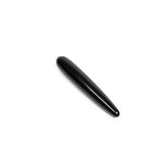 Xaga Slim obsidian wand lying at an angle, revealing polished gloss finish and tapered ends