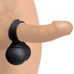 XL black silicone cock ring and vibrating ball sack shown worn on a realistic dildo model