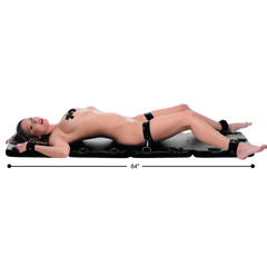 XL Bondage Board laid flat at full 64-inch length with wrist and ankle cuffs attached