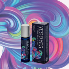 YES O YES Clitoral Stimulant Oil 10ml rollerball bottle beside box, vibrant swirl backdrop