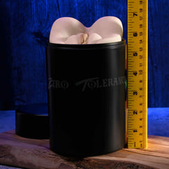 Zero Tolerance canister stroker standing upright beside a ruler showing approximately 7-inch height