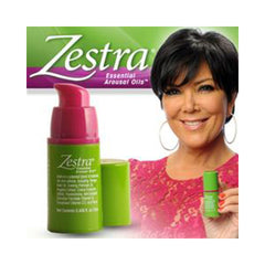 Zestra Essential Arousal Oils pump bottle in green and pink beside a smiling female spokesperson