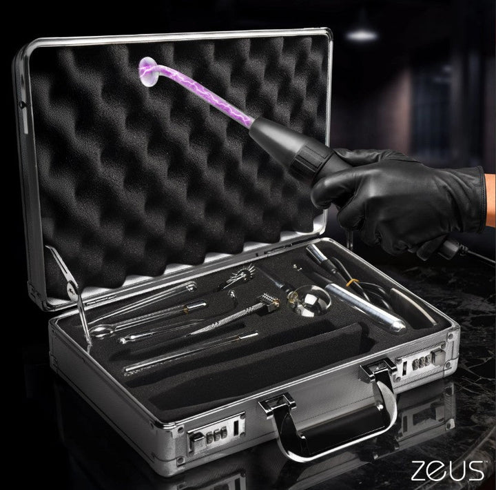 Zeus Ultimate Edition Violet Wand Set displayed open in a locking aluminum carry case with glowing electrode attachment
